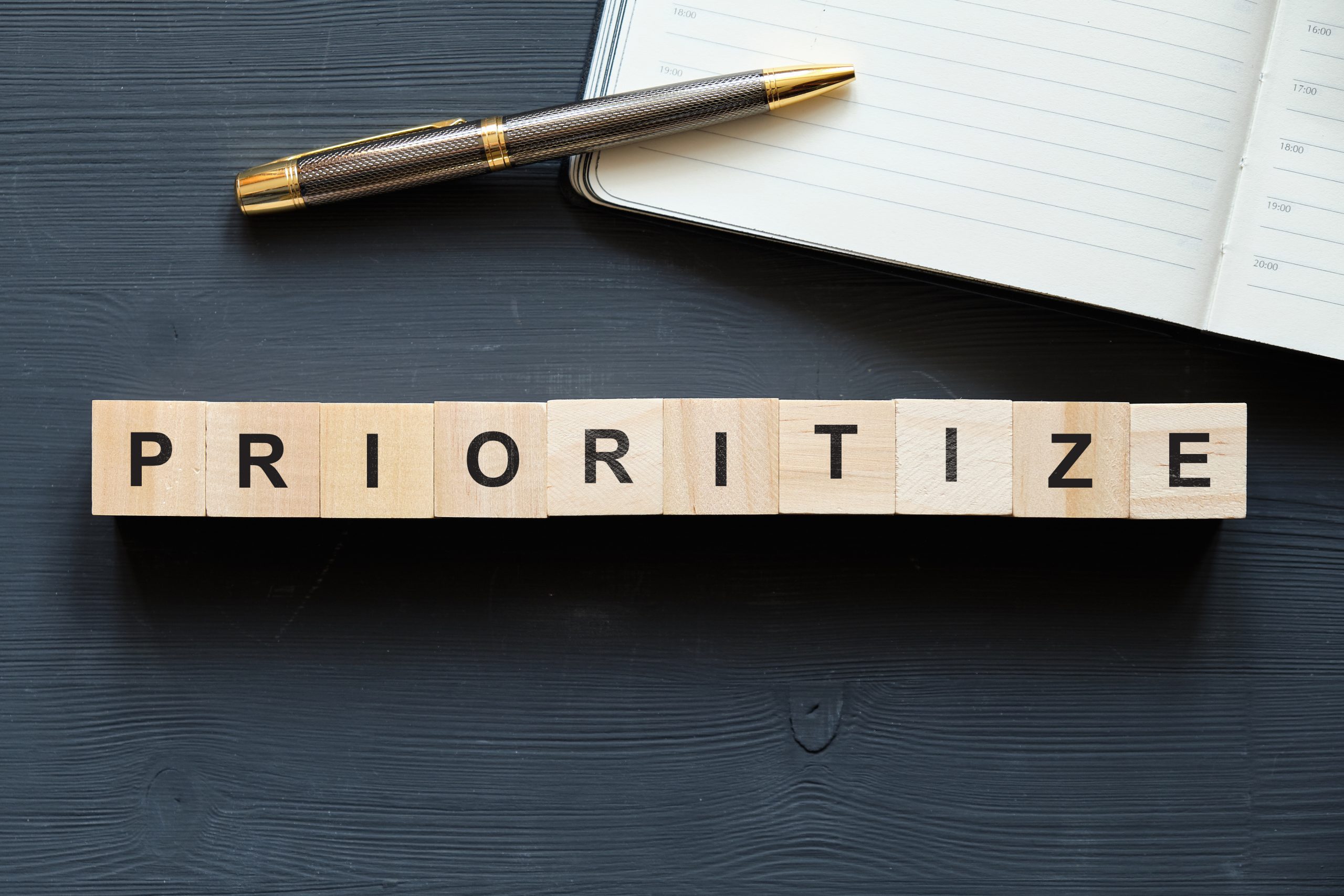 wooden blocks spelling out the word "prioritize"